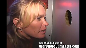 A seductive mature woman enjoys unprotected intercourse in a gloryhole, receiving multiple ejaculations