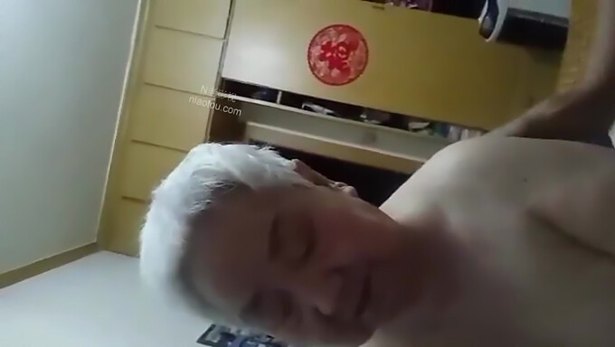 Asian grandma and grandpa engage in intimate activities