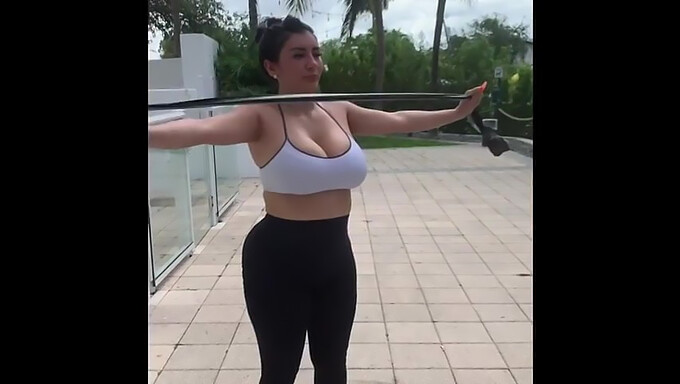 Latina MILF with big breasts and curves exercises at work